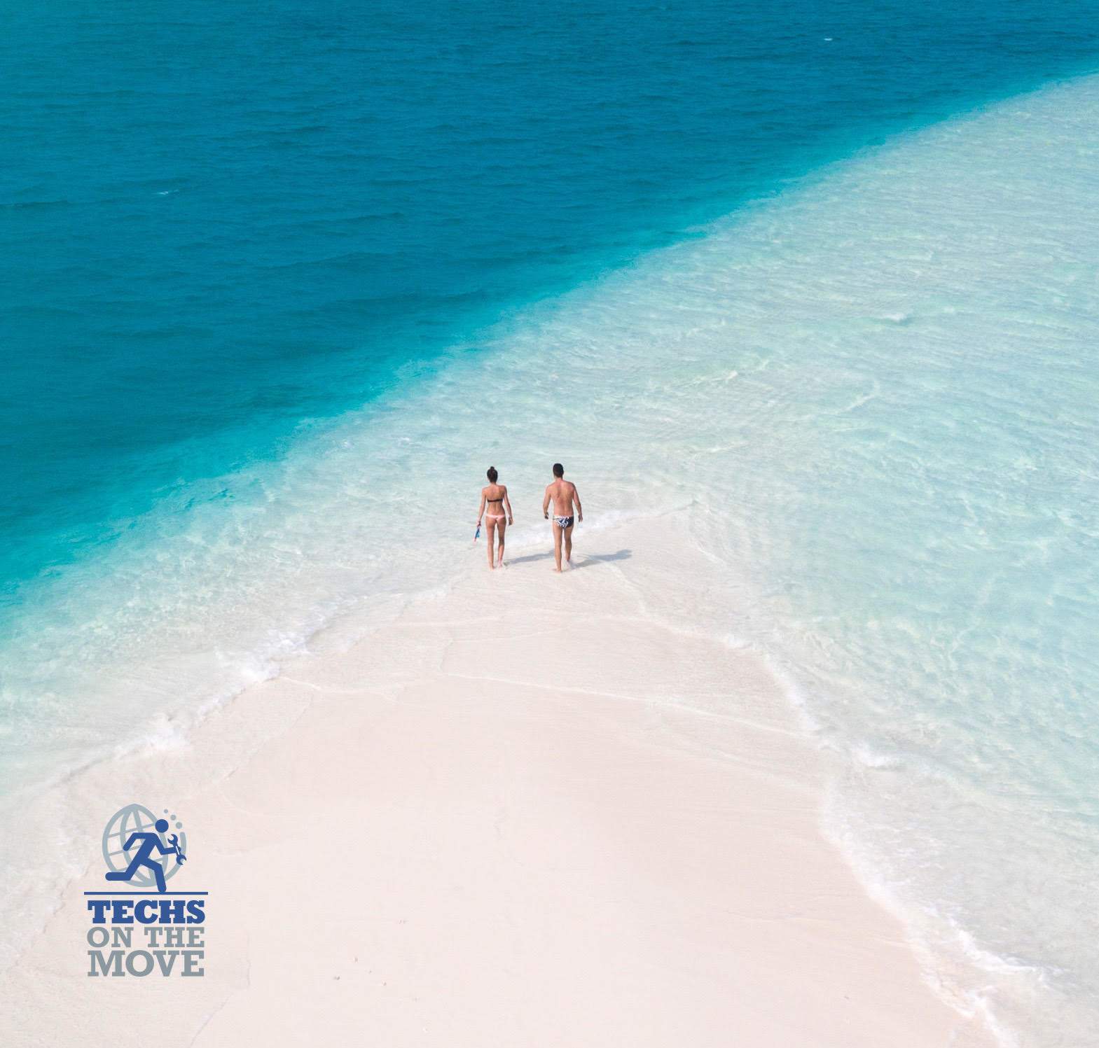 Couple On A Sandy Beach In Australia